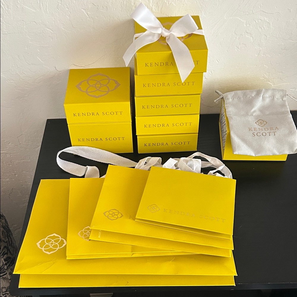 Kendra Scott Yellow boxes with 5 velvet pouches and 4 bags all sizes. 8 boxes